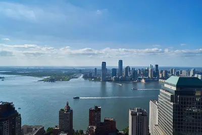 an aerial view of a city with a large body of water at W residence in New York