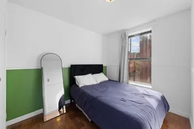 a bedroom with a bed and a window at NY-11-7 Cozy 1BR 1BATH In East Village in New York
