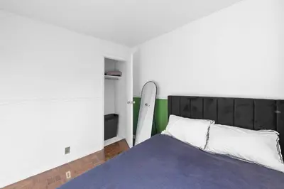 a bedroom with a bed with a surfboard in it at NY-11-7 Cozy 1BR 1BATH In East Village in New York