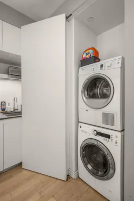 a laundry room with a washer and dryer at Chic NYC Retreat Beside Broadway & Iconic Sights in New York
