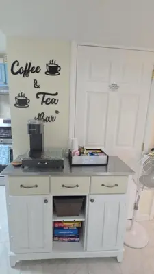 a white desk with a coffee and tea show on the wall at Staten Island Cozy Private 1-br Basement Apt close to NYC Family & Pet Friendly in Willowbrook