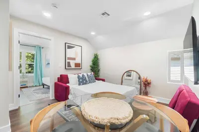 a living room with a couch and a table at Family Suite - Free Parking - Near NYC & Shops at Main Street in North Bergen