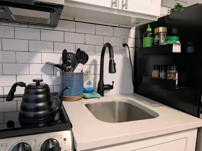 a kitchen counter with a sink and a stove at Apartment near Times Square Manhattan New York in New York