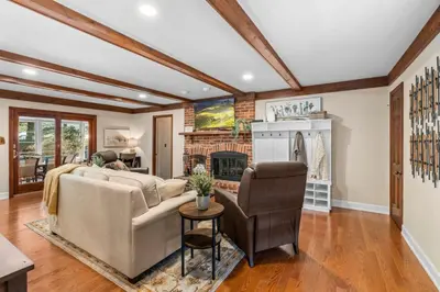 a living room with a couch and a fireplace at Pine Cove Retreat - 4BR - Pool