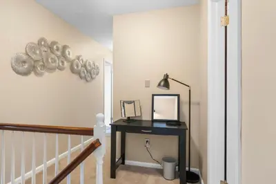 a hallway with a desk and a mirror at Pine Cove Retreat - 4BR - Pool