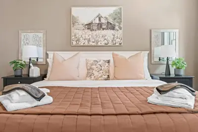 a bedroom with a large bed with two night stands at Pine Cove Retreat - 4BR - Pool