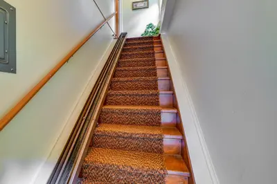 a flight of stairs in a building at Serene Duplex with On-Site Brook in Callicoon Center in Roscoe
