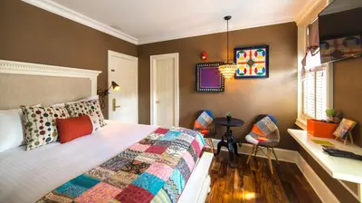 a bedroom with a bed and a desk at Logan Inn in New Hope