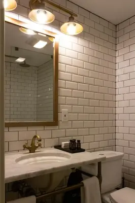 a bathroom with a sink and a mirror at Logan Inn in New Hope