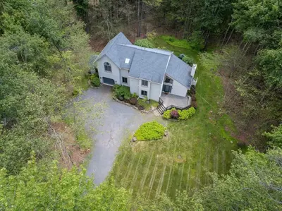 an aerial view of a house in the woods at Pocono Escape Style and Serenity in Pocono Pines