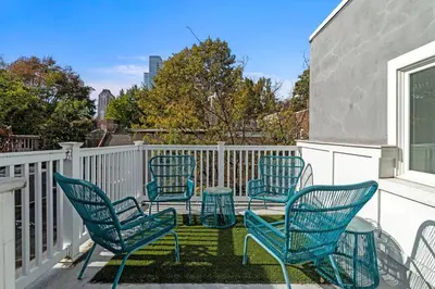 a group of chairs sitting on a balcony at Washington Square West - Unit A in Philadelphia
