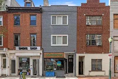a brick building with a store on a street at Washington Square West - Unit A in Philadelphia