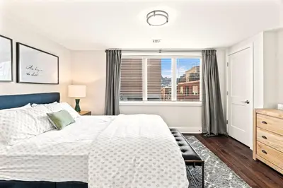 a bedroom with a bed and a window at Washington Square West Unit B in Philadelphia