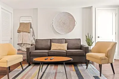 a living room with a couch and two chairs at Washington Square West Unit B in Philadelphia