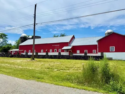a red barn with a silo on top of it at Historic Barn View Modern Country Newton House in Newton
