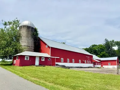 a red barn with a silo on top of it at Historic Barn View Modern Country Newton House in Newton