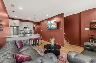 a living room with a couch and a table at Brewerytown Luxurious Home Movie theater in Philadelphia