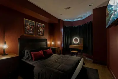 a bedroom with a large bed and a desk at Brewerytown Luxurious Home Movie theater in Philadelphia