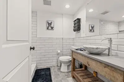 a bathroom with a sink and a toilet at Brewerytown Luxurious Home Movie theater in Philadelphia