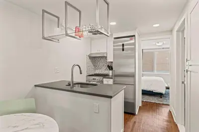 a kitchen with a sink and a refrigerator at Washington Square West in Philadelphia