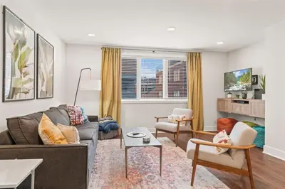 a living room with a couch and a table at Washington Square West in Philadelphia