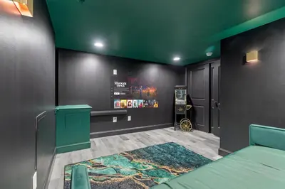 a room with a green ceiling with a bed and a rug at Chic Urban Oasis Movie Theatre in Philadelphia