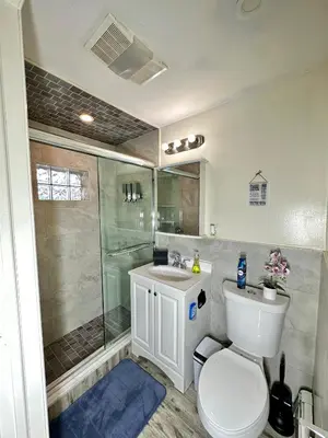 a bathroom with a toilet and a shower and a sink at BP STAYS - Hotel-Style, No Host, Professionally Managed ID260 in Jersey City