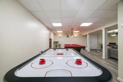 a ping pong table in a room with a pool table at Heated Private Pool Hot Tub Game Room Sauna in Stroudsburg
