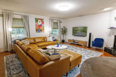 a living room with a couch and a table at Heated Private Pool Hot Tub Game Room Sauna in Stroudsburg