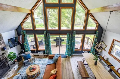 an overhead view of a living room with large windows at Blue Diamond Hot Tub Fire Pit 3 BDR in Tobyhanna