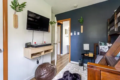 a living room with a flat screen tv on a wall at Blue Diamond Hot Tub Fire Pit 3 BDR in Tobyhanna