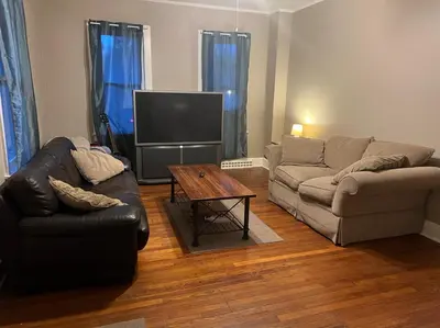 a living room with a couch and a coffee table at Near East Stroudsburg University in East Stroudsburg