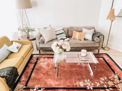 a living room with a couch and a glass coffee table at Garden Oasis 3BR 23min NYC PATH in Harrison