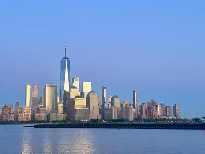 a view of a large city from the water at Renovated private urban flat - 20 min to Manhattan NYC in Jersey City