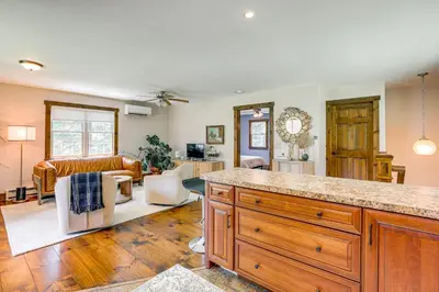 a kitchen and living room with a large counter top at Walk to River Couples Retreat in Kintnersville! in Kintnersville