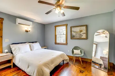 a bedroom with a bed and a ceiling fan at Walk to River Couples Retreat in Kintnersville! in Kintnersville