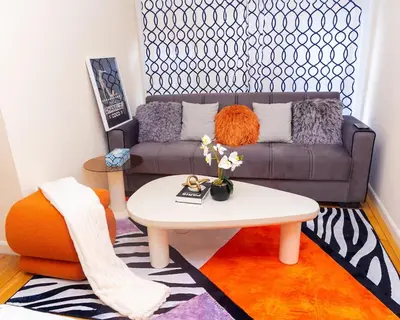 a living room with a couch and a coffee table at Luxury Vibes ,Cozy Location in East Orange
