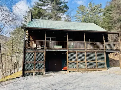 a barn with a porch and a deck at Cammalot - Pine Creek Valley