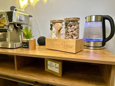 a counter with a coffee maker on a shelf at BP STAYS - Hotel-Style, No Host, Professionally Managed ID247 in Jersey City