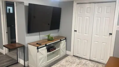 a living room with a flat screen tv on a wall at Fantastic Studio in North Bergen