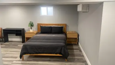 a bedroom with a bed and a piano at Fantastic Studio in North Bergen