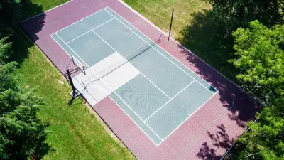 an overhead view of a tennis court in the grass at Pocono Ridge Inn East Stroudsburg - Poconos in East Stroudsburg