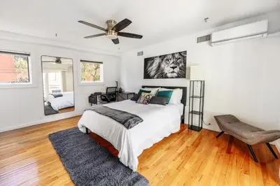 a bedroom with a bed and a ceiling fan at Modern 3BR Townhouse with Private Rooftop & Parking Minutes to NYC in Hoboken