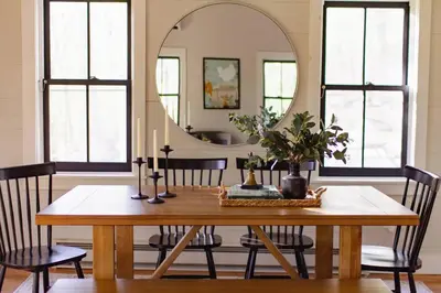 a dining room with a table and a mirror at Fire Pit, Private & Stylish Birdsong Schoolhouse in Barryville