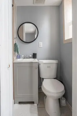 a bathroom with a white toilet and a mirror at One BR near Metlife with Laundry & Parking in Lodi