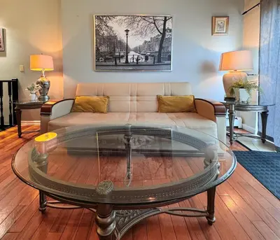 a living room with a couch and a coffee table at New York Skyline One of a Kind View in Union City