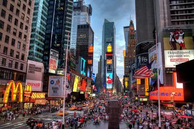 a busy city street with a crowd of people at Double Room at a shared Apartment near Times Square in New York