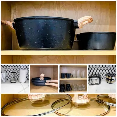 a large black pot on a shelf with other items at Newly Renovated 2B 2BA apt! mins to PATH & NY! in Jersey City