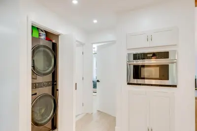 a kitchen with two washers and a microwave at Private Yard, Playset Family Home in Penn Estates in East Stroudsburg