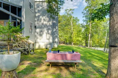 a picnic table in a yard next to a house at Private Yard, Playset Family Home in Penn Estates in East Stroudsburg